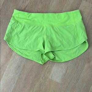 Lululemon Vibrant Green Athletic Running Shorts with Curved Hem